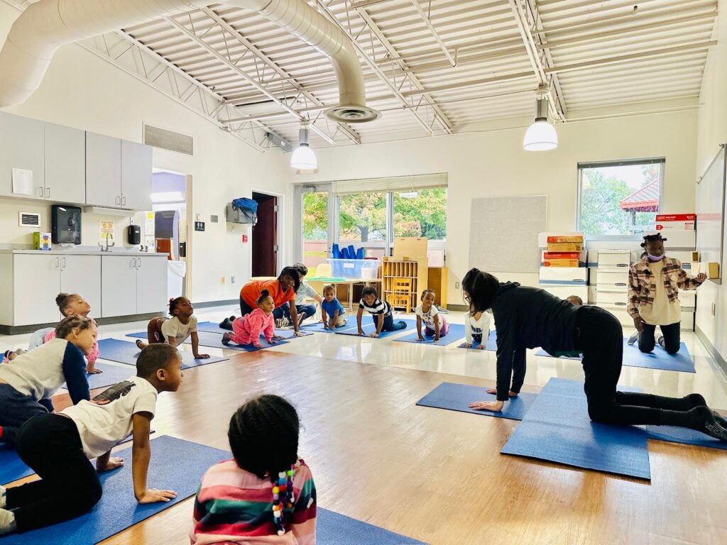 Project Yoga Program Manager Liz C. teaches little ones and adults