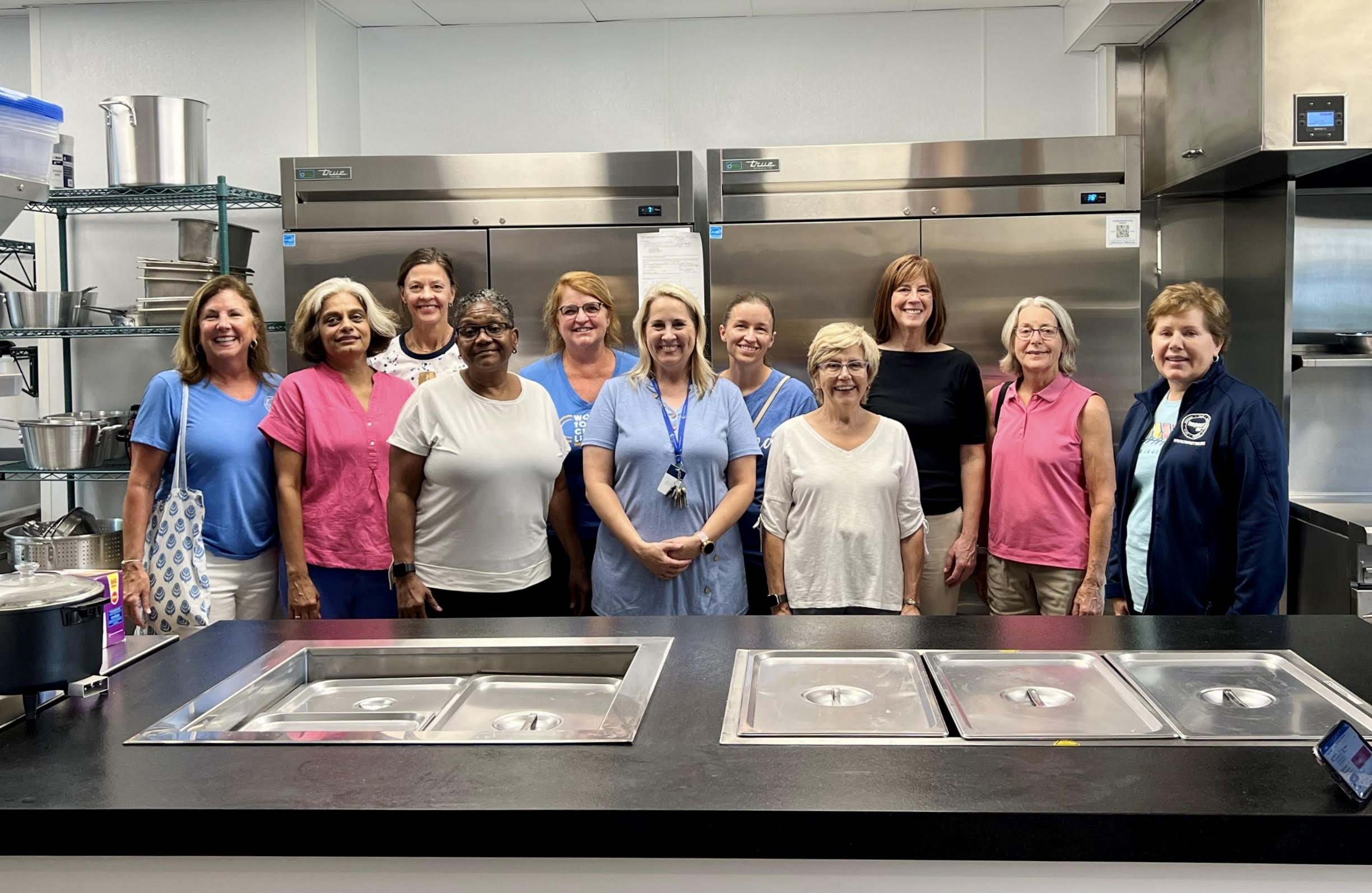 Volunteers build community in the kitchen Impact 100 helped fund at the Martha S. Lindner Center for Transformation.